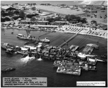 NASPH ^119944- 3 Nov 1943, USS Oklahoma- Salvage- Aerial view from port side aft during pumping operations for... - NARA - 296957