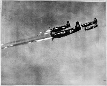 Navy Sky Raiders from the USS Valley Forge fire 5-inch wing rockets at North Korean communist field positions. - NARA - 520777