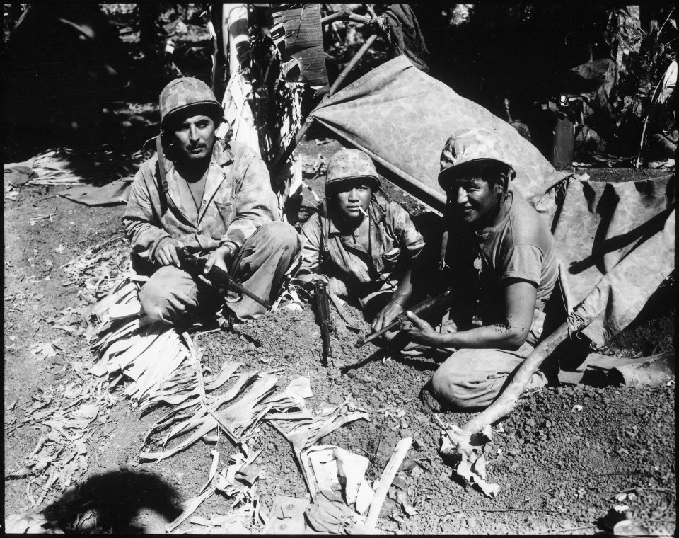 Navajo Indian communication men with the Marines on Saipan landed with the first assault waves to his the beach. - NARA - 532526