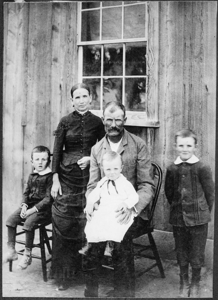 No original caption. (Woman standing with her family.) - NARA - 523553