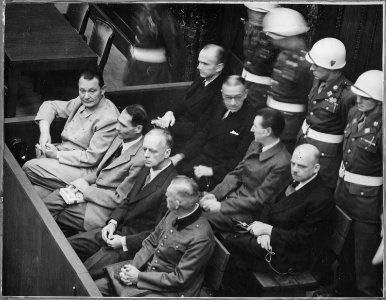 Nuremberg Trials. Defendants in their dock; Goering, Hess, von Ribbentrop, and Keitel in front row, circa 1945-1946., ca. 1945 - ca. 1946