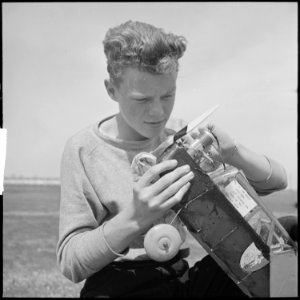 Oakland, California. High School Youth. Notice the identification on the model. Although gas models are limited to... - NARA - 532228 photo