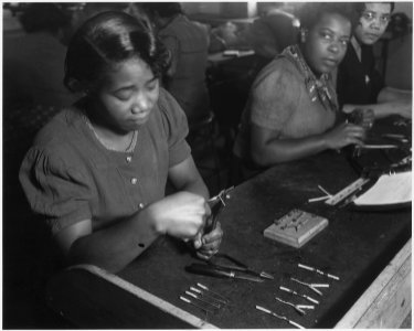 No original caption. Credit Vocational Schools, Baltimore. (African-American Woman working at what appears to be... - NARA - 516348 photo