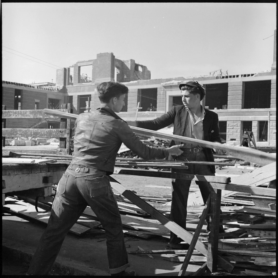 Oakland, California. Hanging Around. Out of high school for a year, their contribution to the family income is wood... - NARA - 532234