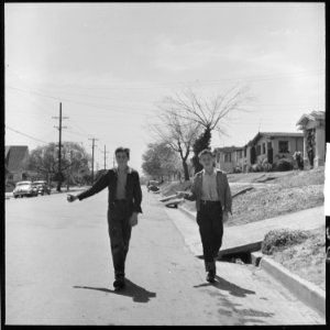 Oakland, California. Hitch-hiking. Thumbing is used as a means of transportation within city limits. Although within... - NARA - 532092 photo