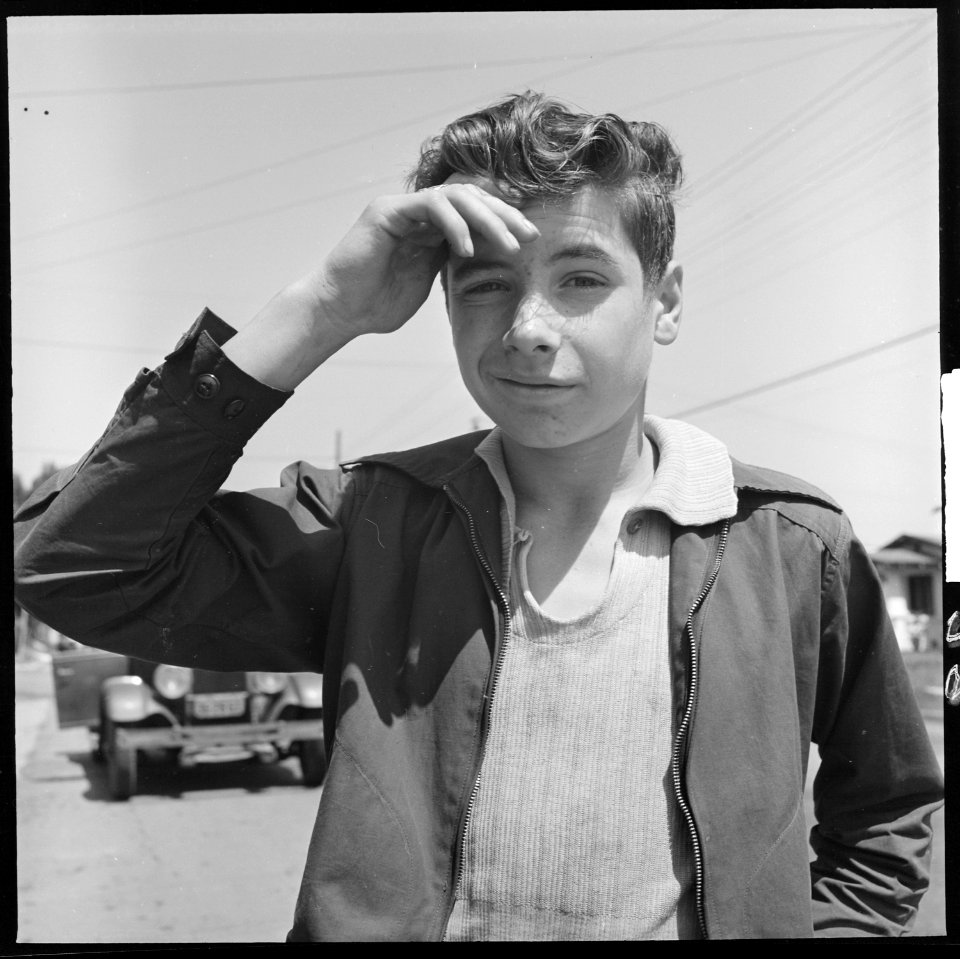 Oakland, California. Hitch-hiking. Typical teenage hitch-hiker within the city limits - NARA - 532093
