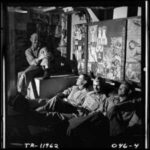 Officers aboard the USS Lexington (CV-16) chatting in the flight deck control office. - NARA - 520911