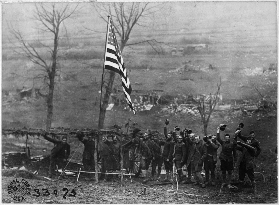 One of the guns of Battery D, 105th Field Artillery, showing American flag which was hoisted after the last shot had... - NARA - 530777
