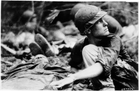 Operation Billings Medic from the 1st Battalion, 16th Infantry, 1st Infantry Division, searches the sky for a... - NARA - 531449 photo