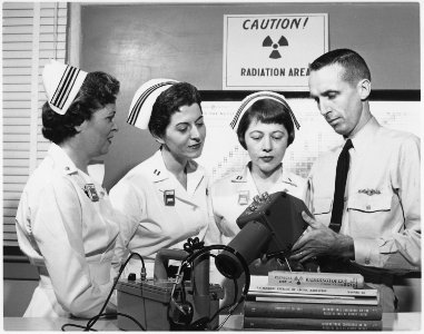 Nuclear Nursing - Chief Hospitalman Lee Jones, U.S. Navy, of Silver Spring, Maryland, demonstrates radiation survey... - NARA - 521004 photo