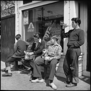 Oakland, California. High School Youth. Typical of the youth of this nation is the tipped-up bottle of pop. Also... - NARA - 532259