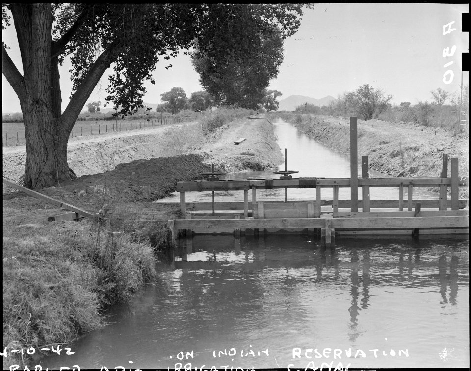 Parker, Arizona. The land is plentiful. But the water is scarce. Irrigation canals such as that . . . - NARA - 536249