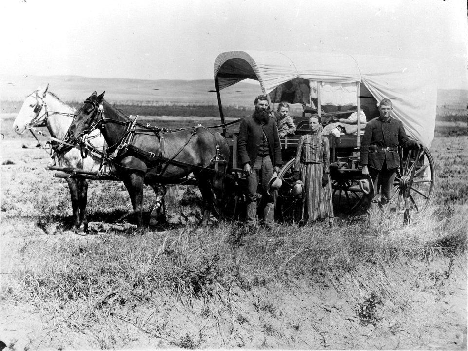 Photograph of a Family with Their Covered Wagon During the Great Western Migration, 1866 - NARA - 518267
