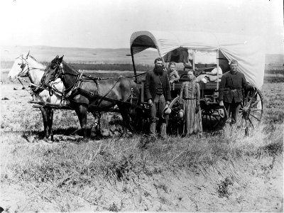 Photograph of a Family with Their Covered Wagon During the Great Western Migration, 1866 - NARA - 518267