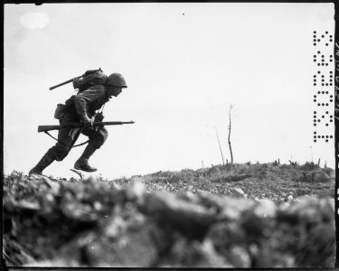 Photograph of a Marine Charging Japanese Machine Guns on Okinawa - NARA - 532554