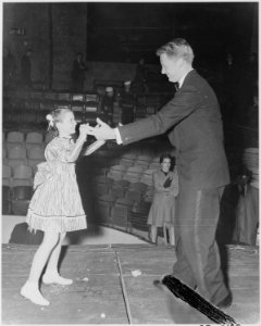 Photograph of actor Van Johnson dancing with Margaret O'Brien at a Roosevelt Birthday Ball event. - NARA - 199337 photo