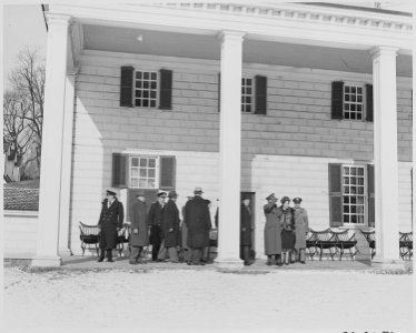 Photograph of a group of dignitaries, including British Field Marshal Harold Alexander and Mrs. Alexander, outside... - NARA - 199505 photo