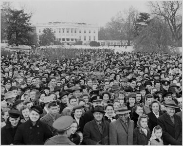 Photograph of a large crowd assembled on the South Lawn of the White House for the lighting of the National Community... - NARA - 199270