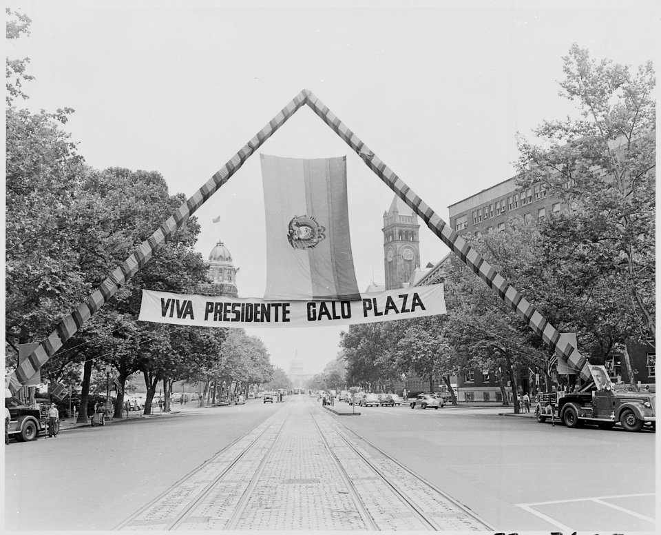 Photograph of banner hanging over a Washington street to welcome President Galo Plaza of Ecuador to the United States. - NARA - 200298