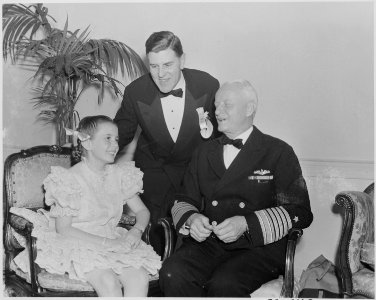 Photograph of actress Margaret O'Brien with Admiral Chester Nimitz and an unidentified man. - NARA - 199318