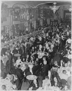 Photograph of ballroom filled with diners, probably during the Roosevelt Birthday Ball in Washington. - NARA - 199327