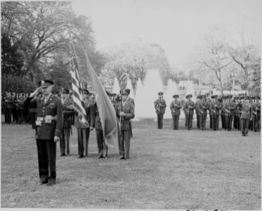 Photograph of color guard and troops on the White House lawn, participating in welcoming ceremonies for President... - NARA - 199239