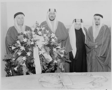 Photograph of Crown Prince Amir Saud of Saudi Arabia, with three other Saudi Arabian dignitaries, placing a wreath on... - NARA - 199523