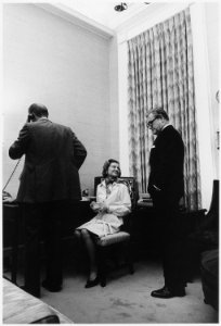 Photograph of Betty Ford Talking to Vice President-Designate Nelson A. Rockefeller While President Ford Speaks on the... - NARA - 186762