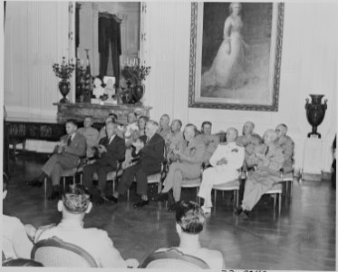 Photograph of dignitaries applauding during Medal of Honor presentation ceremony in the East Room of the White House... - NARA - 199197