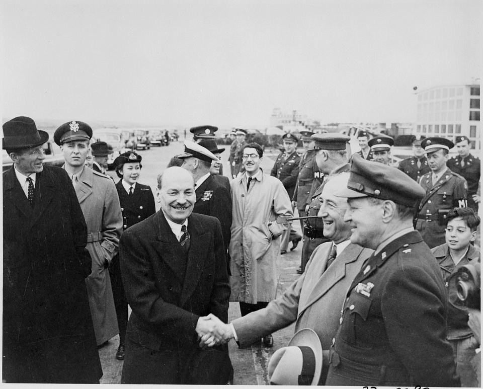 Photograph of British Prime Minister Clement Attlee shaking hands with Secretary of State James Byrnes upon arrival... - NARA - 199247
