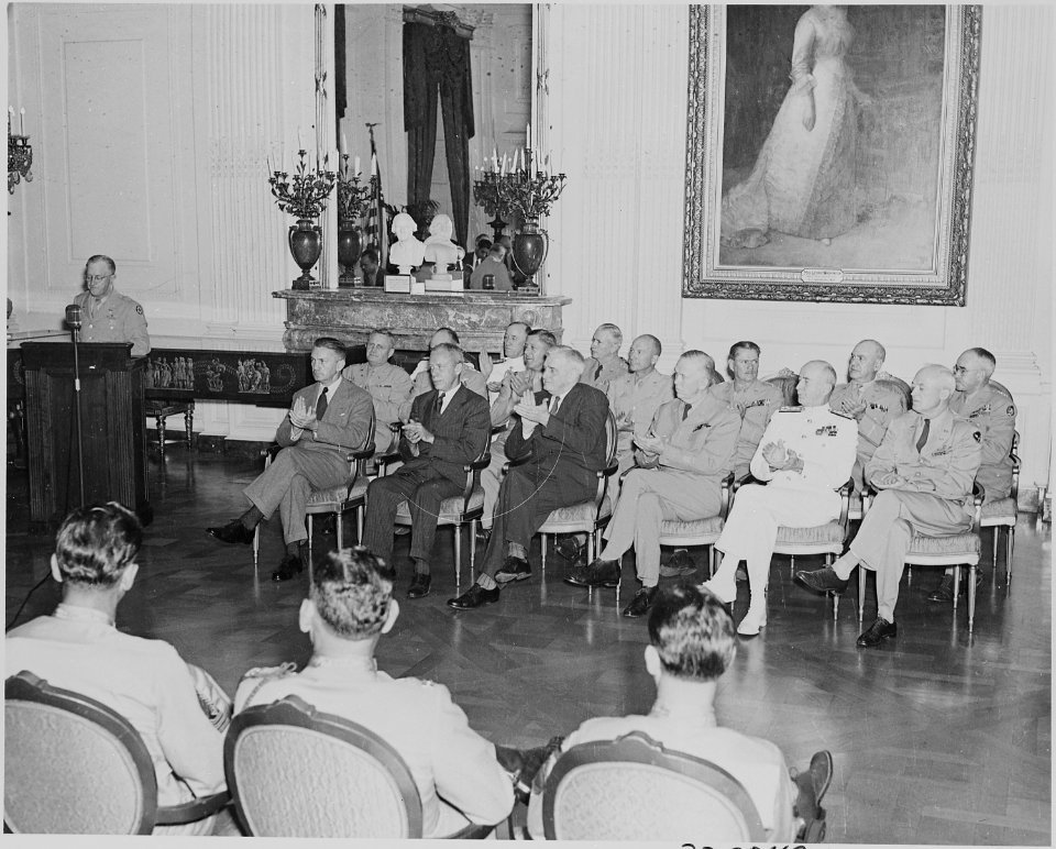 Photograph of dignitaries applauding during Medal of Honor presentation ceremony in the East Room of the White House... - NARA - 199196