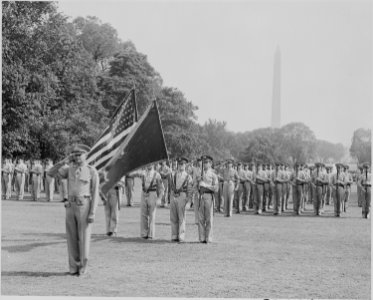 Photograph of color guard and troops participating in welcoming ceremonies for French General Charles de Gaulle, on... - NARA - 199188