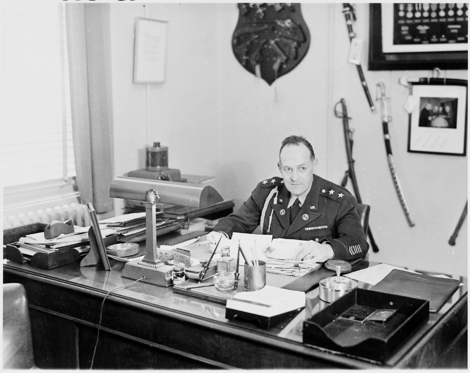Photograph of General Harry H. Vaughan, Military Aide to the President, at his desk in his White House office. - NARA - 200274