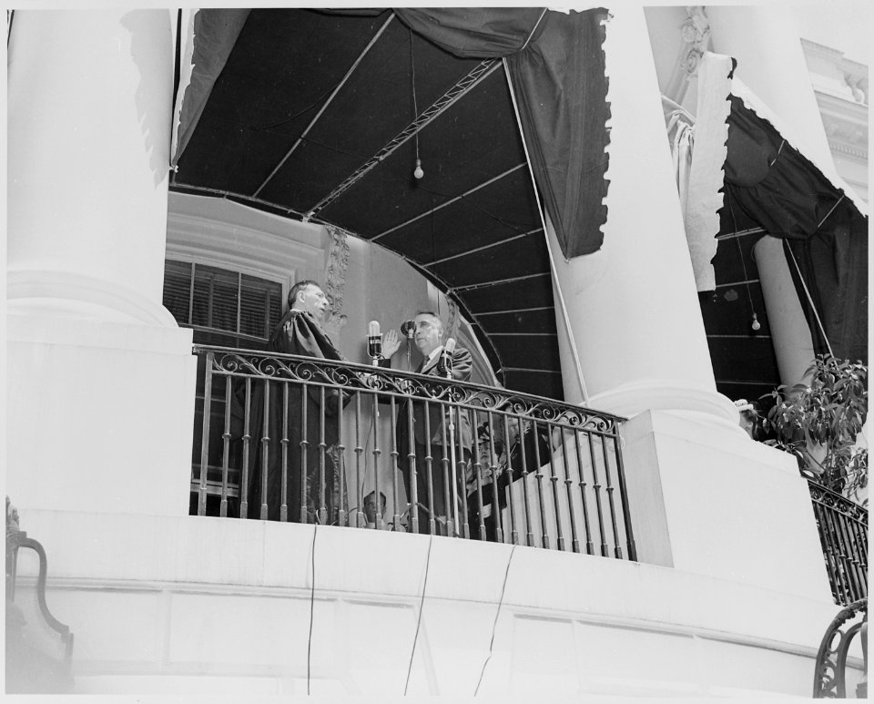 Photograph of Fred Vinson being sworn in as Chief Justice of the United States at the South Portico of the White House. - NARA - 199373