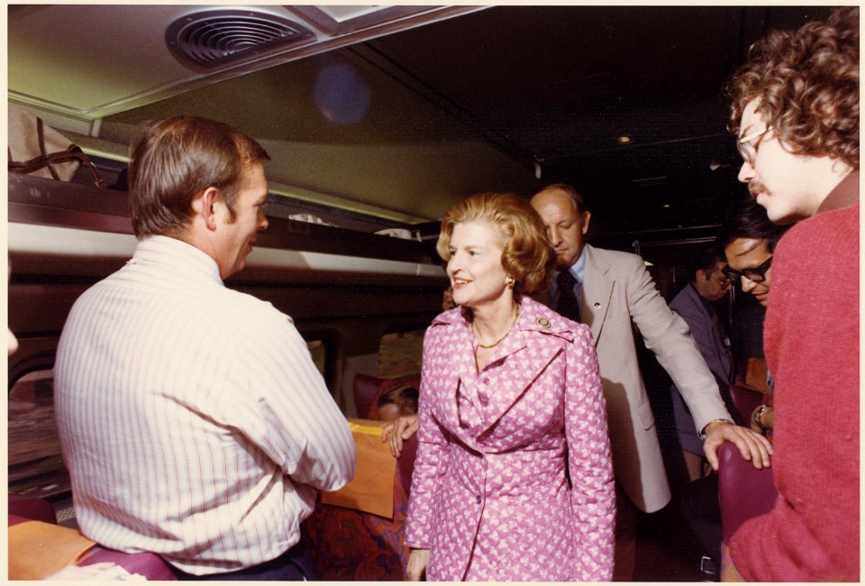 Photograph of First Lady Betty Ford Holding an Impromptu Press Conference in the Press Car while Crossing Michigan... - NARA - 186828