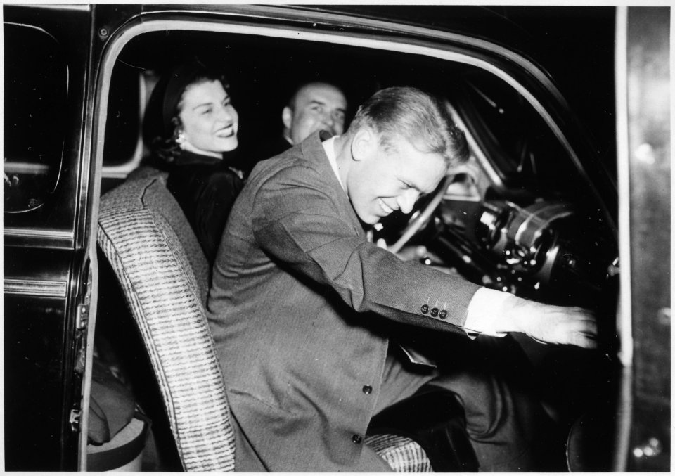 Photograph of Gerald R. Ford, Jr., and Betty Ford in the Front Seat of an Automobile Following Their Wedding Reception - NARA - 186986