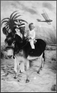 Photograph of Gerald R. Ford, Jr., (Then Leslie Lynch King, Jr.) Sitting on a Donkey while his Mother, Dorothy... - NARA - 186900