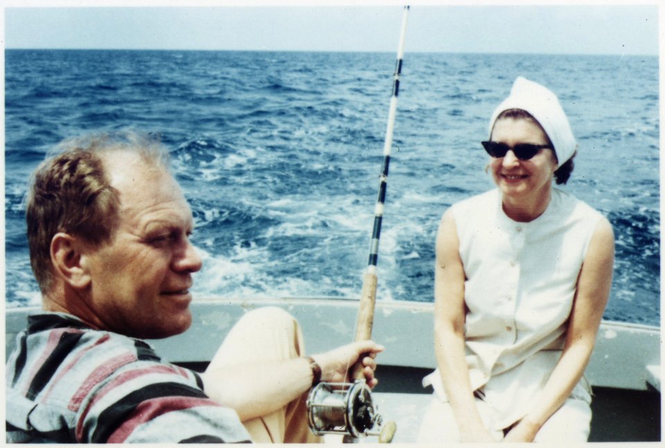 Photograph of Gerald R. Ford and Betty Ford Talking, While Mr. Ford Deep-Sea Fishes During a Vacation Trip Vacation... - NARA - 186972
