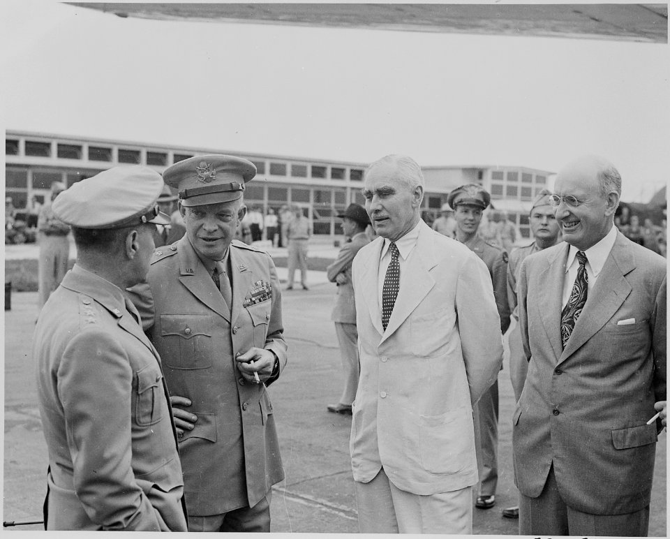 Photograph of General Dwight D. Eisenhower with a group of unidentified persons, probably at the airport in Washington. - NARA - 199123