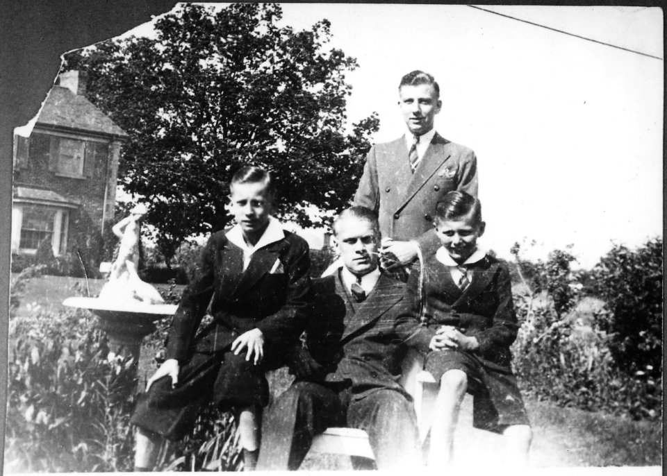 Photograph of Gerald R. Ford, Jr., Flanked by Richard A. Ford, and James F. Ford, with Thomas G. Ford Standing Behind... - NARA - 186915
