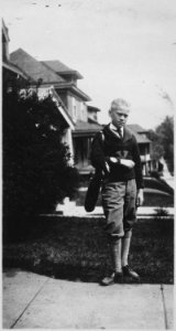 Photograph of Gerald R. Ford, Jr., in Golf Attire, Standing in Front of His Grand Rapids, Michigan Home - NARA - 186958