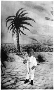 Photograph of Gerald R. Ford, Jr., (Then Leslie Lynch King, Jr.) Holding a Toy Boat, Posing for a Portrait - NARA - 186917