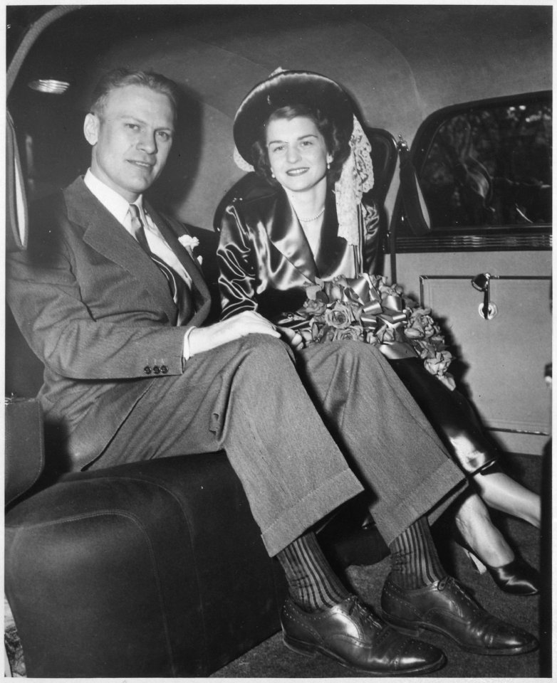 Photograph of Gerald R. Ford, Jr., and Betty Ford Sitting in the Back Seat of an Automobile Outside of Grace... - NARA - 186889