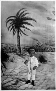 Photograph of Gerald R. Ford, Jr., (Then Leslie Lynch King, Jr.) Posing for a Portrait while Holding a Toy Boat - NARA - 186903