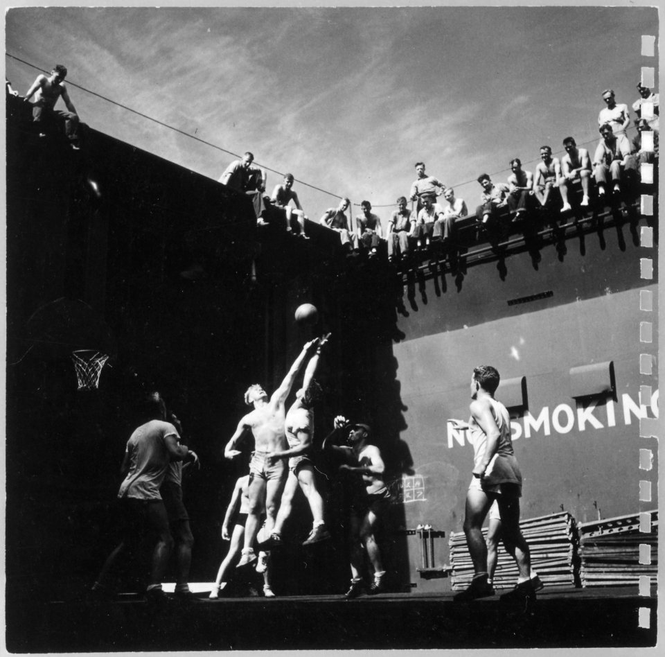 Photograph of Gerald R. Ford Fighting for the Tip-Off During a Basketball Game Aboard the U.S.S. Monterey - NARA - 187035