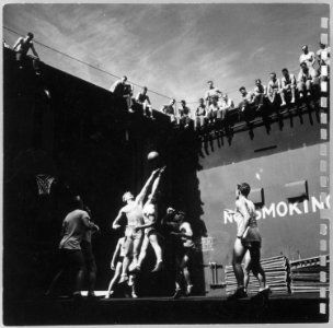 Photograph of Gerald R. Ford Fighting for the Tip-Off During a Basketball Game Aboard the U.S.S. Monterey - NARA - 187035