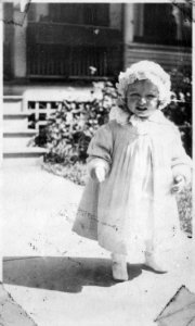 Photograph of Gerald R. Ford, Jr., (Then Leslie Lynch King, Jr.) Standing on Front Walk of 1960 Terrrace Avenue, SE... - NARA - 186857