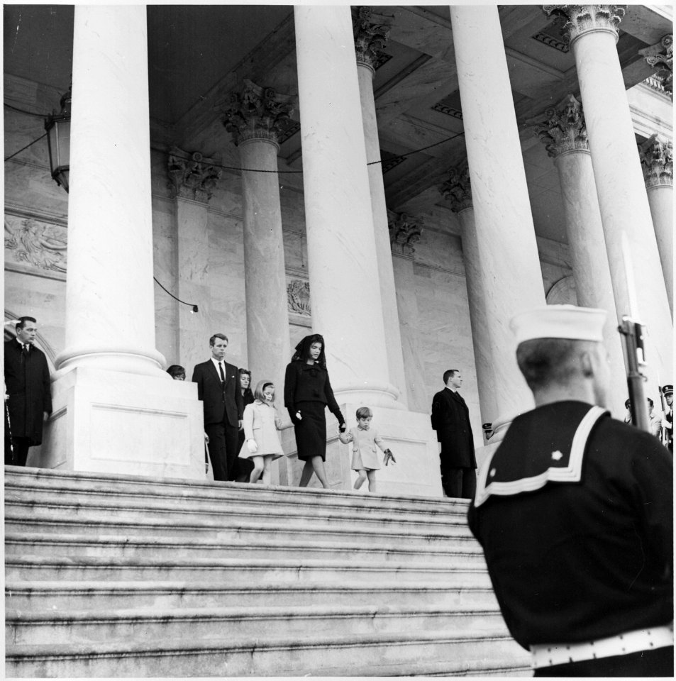 Photograph of Jacqueline Kennedy leaving the Capitol with her children, Caroline and John, Jr., and her... - NARA - 200458
