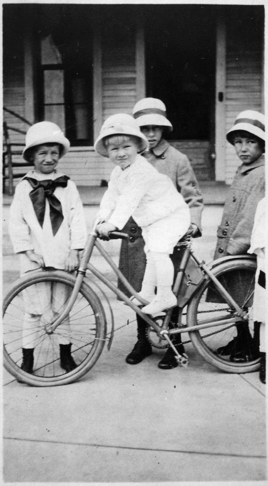 Photograph of Gerald R. Ford, Jr., Seated on a Bicycle, Posing with his Cousin Gardner James and Two Unidentified Girls - NARA - 186920
