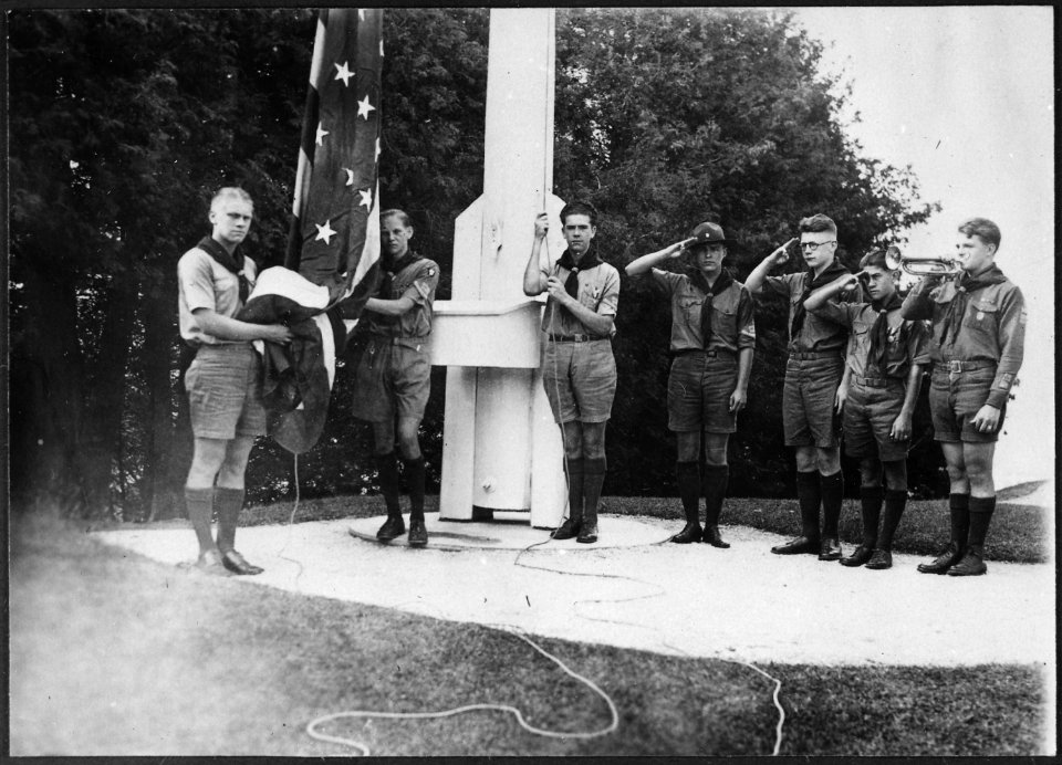 Photograph of Gerald R. Ford, Jr., Holding the Flag, with Fellow Members of the Eagle Scout Guard of Honor, at Fort... - NARA - 186933